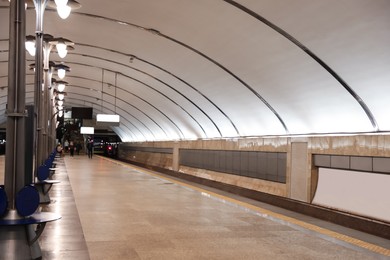 Spacious subway station with sitting places. Public transport