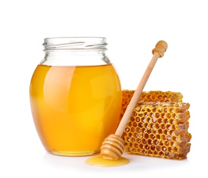Composition with fresh honey on white background
