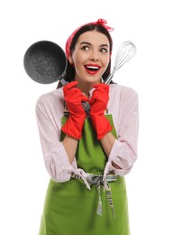 Young housewife with saucepan and whisk on white background