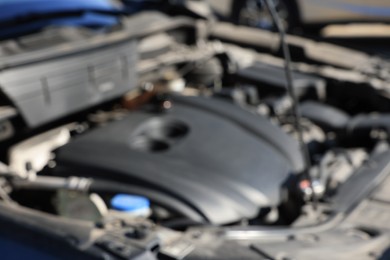 Photo of Blurred view of car engine in modern auto