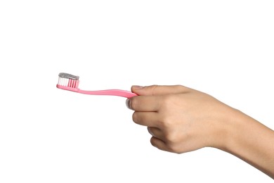 Woman holding brush with charcoal toothpaste against white background, closeup