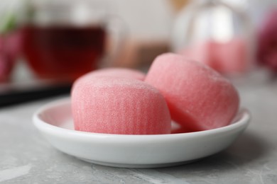 Plate with delicious mochi on grey table, closeup. Traditional Japanese dessert