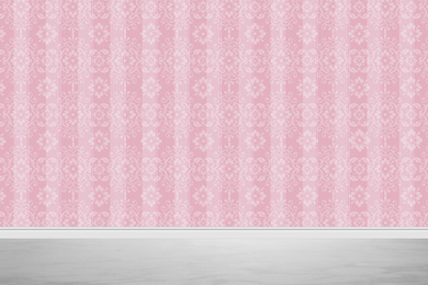 Pink wallpaper and grey floor in room