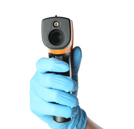 Doctor in latex gloves holding non-contact infrared thermometer on white background, closeup