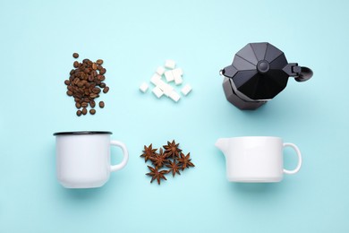 Photo of Flat lay composition with roasted beans and geyser coffee maker on light blue background