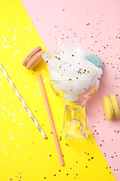 Flat lay composition with sweet cotton candy on color background