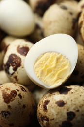 Photo of Heap of unpeeled and peeled hard boiled quail eggs as background, closeup