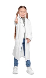 Photo of Little girl in medical uniform showing thumb up on white background