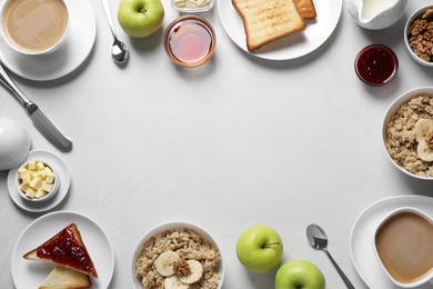Flat lay composition with tasty breakfast food and coffee on white table. Space for text