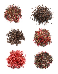 Set with heaps of different peppercorns on white background, top view