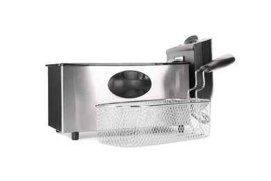 Photo of Modern deep fryer and baskets on white background. Kitchen device