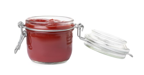 Tasty ketchup in glass jar isolated on white