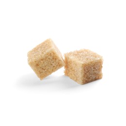 Two brown sugar cubes isolated on white