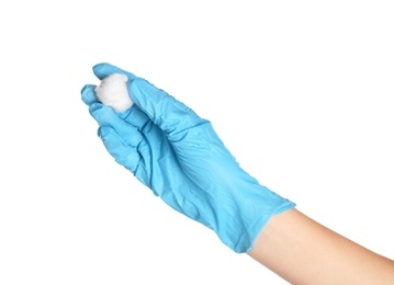 Doctor in sterile glove holding medical cotton ball on white background