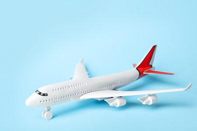 Toy plane on blue background. Logistics and wholesale concept