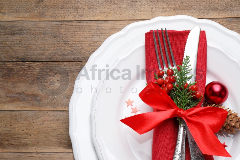 Beautiful Christmas table setting on wooden background, top view