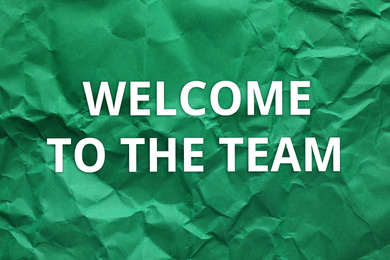 Crumpled paper with phrase Welcome to the team