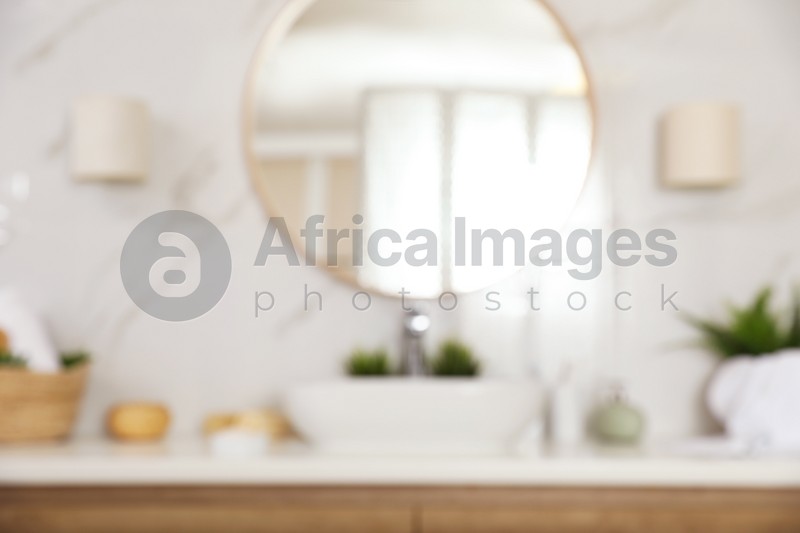 Photo of Blurred view of stylish modern bathroom with mirror