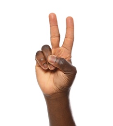 African-American man showing PEACE sign on white background, closeup