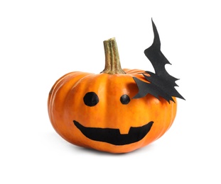 Halloween pumpkin with cute drawn face and paper bat isolated on white