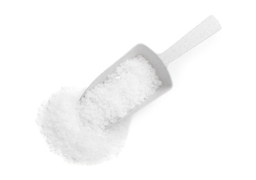 Natural sea salt and scoop on white background, top view