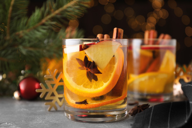 Aromatic white mulled wine on light grey table