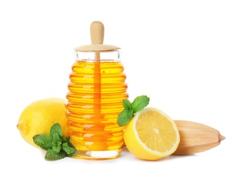 Jar of honey, mint, lemons and juicer on white background. Cough remedies