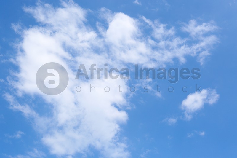 Beautiful blue sky with fluffy clouds, low angle view