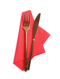 Photo of Red napkin with golden fork and knife on white background, top view