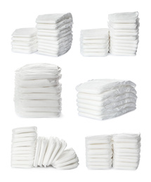 Image of Set of baby diapers on white background