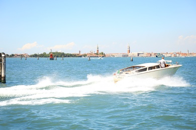 VENICE, ITALY - JUNE 13, 2019: Picturesque seascape with launch boat