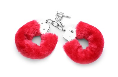 Red furry handcuffs on white background, top view. Accessory for sexual roleplay
