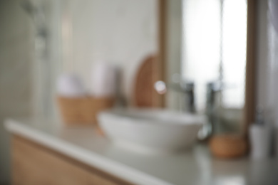 Blurred view of light modern bathroom interior