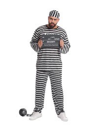 Prisoner in special uniform with mugshot letter board and metal ball on white background