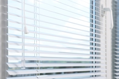Window with horizontal blinds indoors, closeup view