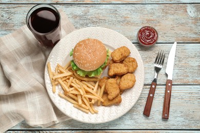 Delicious fast food menu on white wooden table, flat lay