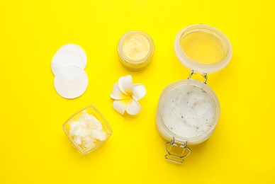 Flat lay composition with beeswax cosmetics on yellow background