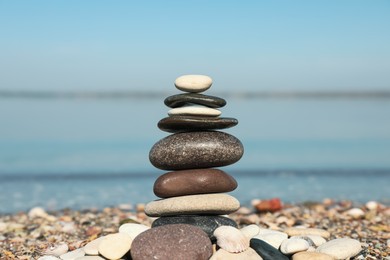 Stack of stones on beach, closeup. Harmony and balance concept