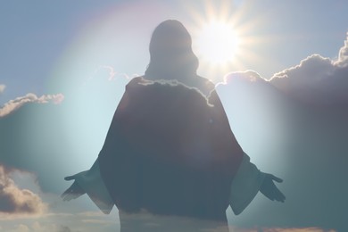Image of Silhouette of Jesus Christ and cloudy sky, double exposure