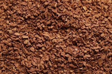 Photo of Dry instant coffee as background, top view