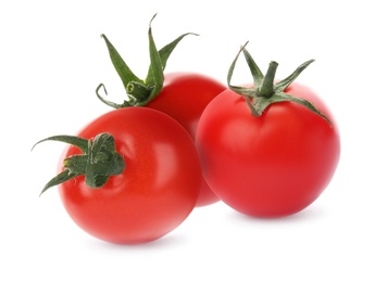 Whole red fresh tomatoes on white background