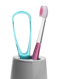 Holder with tongue cleaner and toothbrush on white background