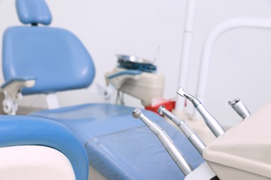 Set of professional equipment in dentist's office, space for text
