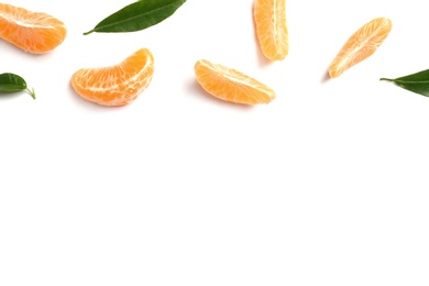 Composition with tangerine segments and leaves on white background, top view. Space for text