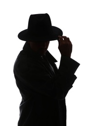 Silhouette of old fashioned detective on white background