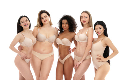 Group of women with different body types in underwear on white background