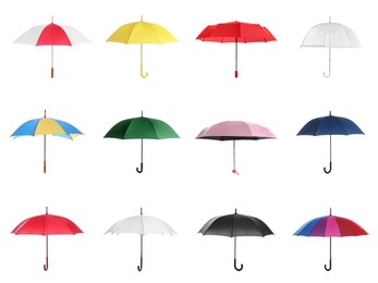 Set with different stylish umbrellas on white background 