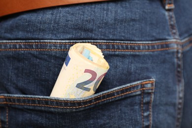 Euro banknotes in pocket of jeans, closeup. Spending money
