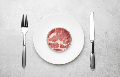 Lab grown meat in Petri dish served on light grey table, flat lay