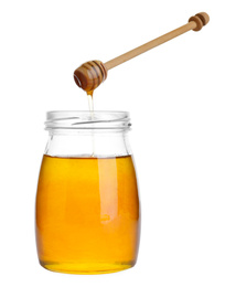 Glass jar of sunflower honey and wooden dipper isolated on white
